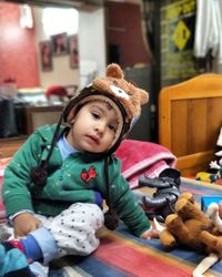Portrait of cute girl playing with toy