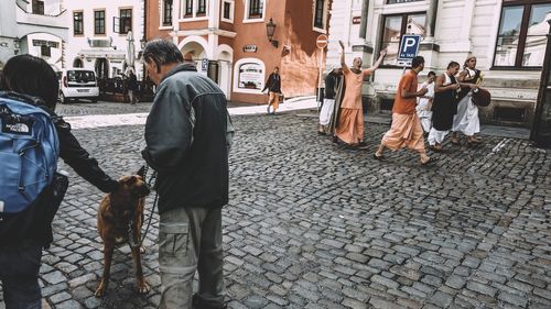 People walking on street in city