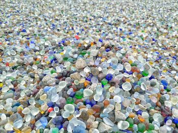 High angle view of multi colored pebbles on rocks