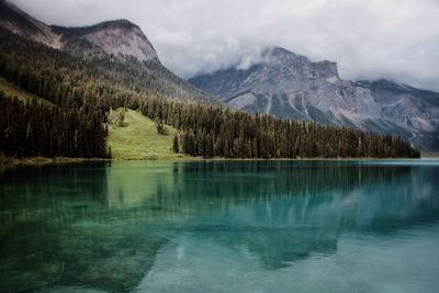 Scenic view of lake and mountains against sky