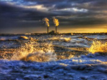 Scenic view of sea against cloudy sky