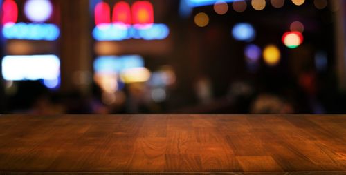 Defocused image of illuminated lights on table