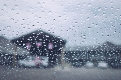 Close-up of wet window in rainy season