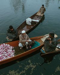 High angle view of people sitting on boat