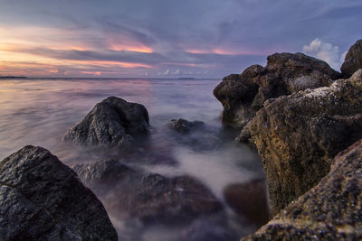 A dusk at ujung gelam beach. scenic view of sea against sky during sunset