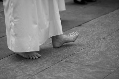 Low section of woman standing on floor