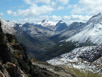 Scenic view of mountains against cloudy sky