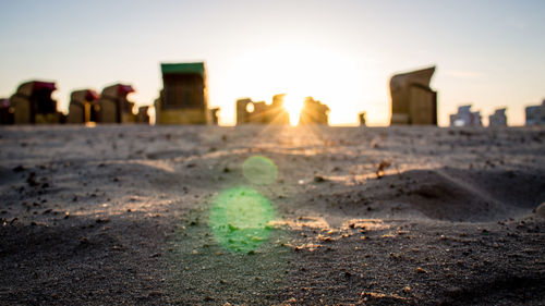 Close-up of sand at beach against sky