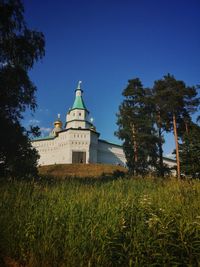 Low angle view of building against clear blue sky