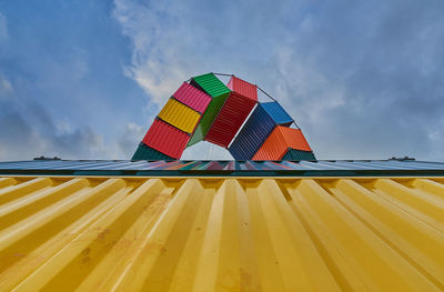 Low angle view of hot air balloons against sky