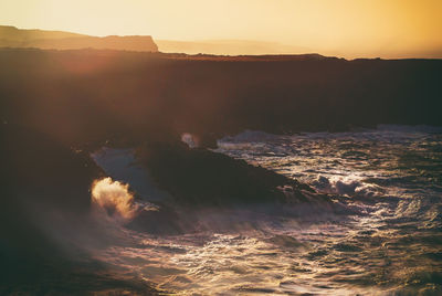 Scenic view of sea against sky during sunset