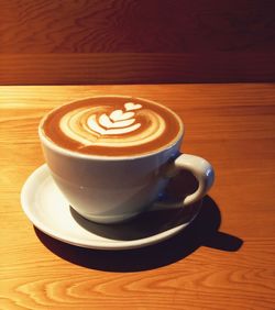 Close-up of cappuccino on table