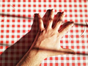 Close-up of human hand on table