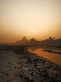 Scenic view of taj against sky during sunsunrise