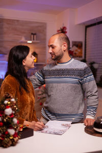 Young couple standing at home