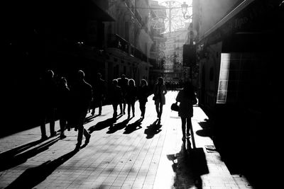 People walking on street in city