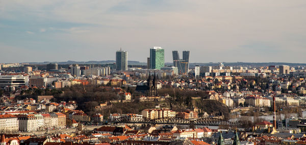 High angle view of modern buildings in city against sky