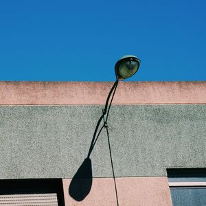 Low angle view of built structure against blue sky