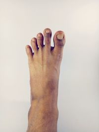 Close-up of hand against white background