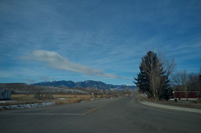 Empty road with mountain in background