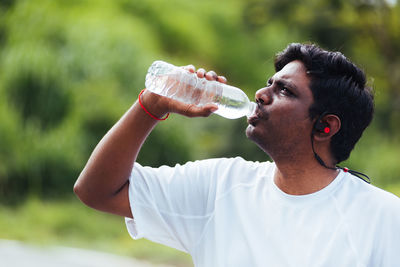 Man drinking water bottle