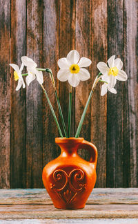 Close-up of white flower vase on table