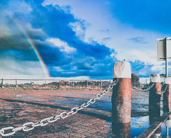 Scenic view of rainbow against blue sky