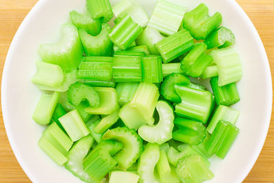 High angle view of chopped vegetables in bowl on table