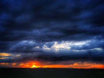 Scenic view of dramatic sky during sunset