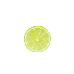 Close-up of lemon slice against white background