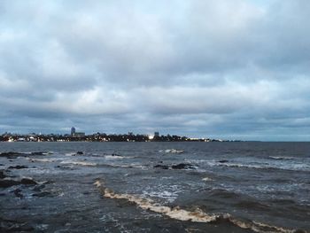 View of calm sea against cloudy sky