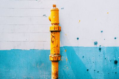 Close-up of fire hydrant by swimming pool