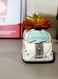 Close-up of flower vase on table