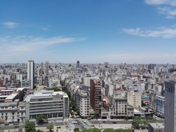 High angle view of buildings in city against sky