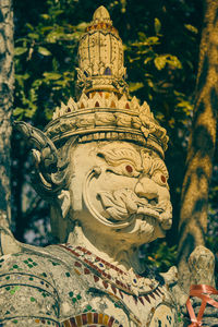 Close-up of statue against temple