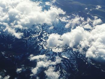 Aerial view of clouds over mountains
