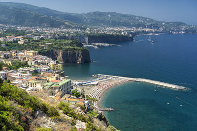 High angle view of townscape by sea