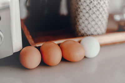 Close-up of eggs in container on table