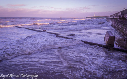 Scenic view of sea against sky at sunset