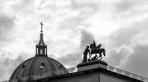 Low angle view of statue against sky