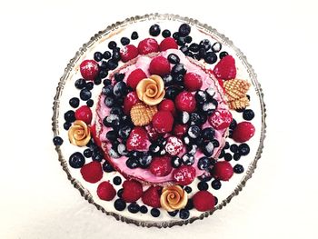 High angle view of dessert on table against white background