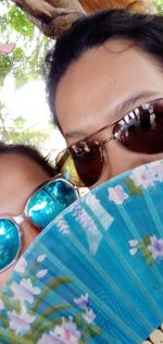 Close-up portrait of a girl wearing sunglasses