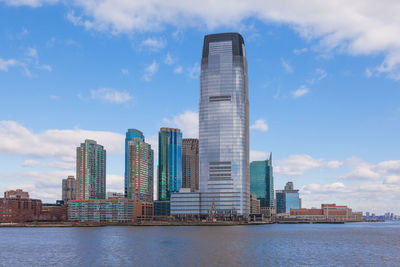 Modern buildings in city against sky