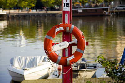 Close-up of red boat moored at harbor