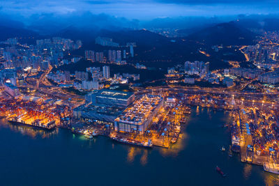 High angle view of city lit up at night