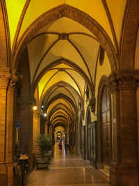 People walking in corridor of building