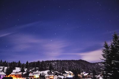 Scenic view of mountains against blue sky at night