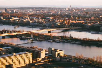 High angle view of bridge over river by buildings in city