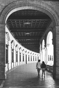 Full length of woman walking in colonnade