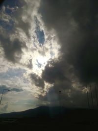 Low angle view of silhouette landscape against sky